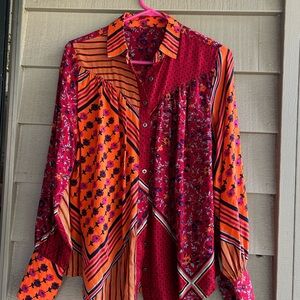 Free People blouse soft feel geometric pattern with rich color contrasts. Sz S
